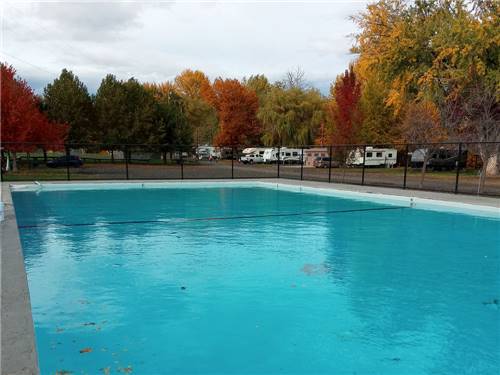 Pool with RVs in the background