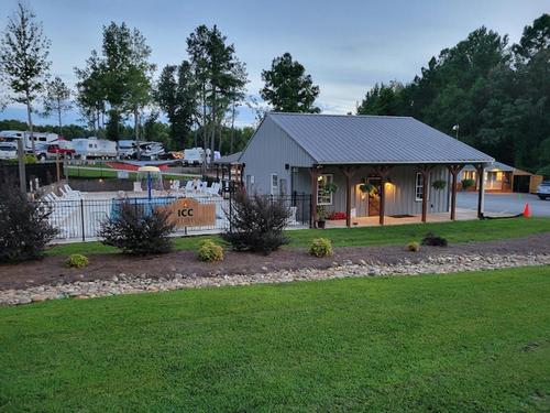 Grassy field next to office Iron City Campground