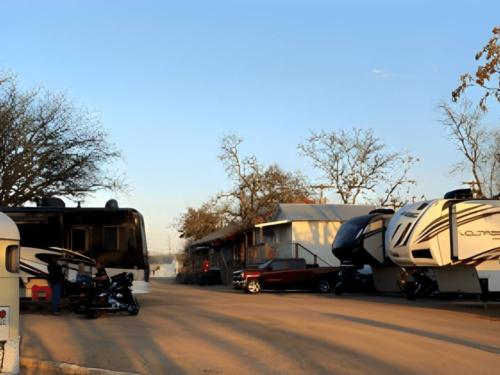 Parked trailer at site River Trail Cottages & RV Park