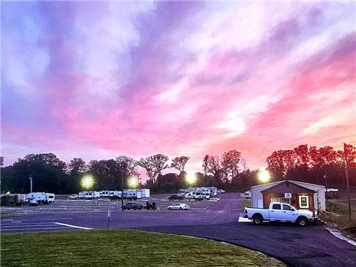 A multi colored sunset over the park