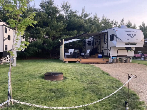 RV in a site with a fire ring