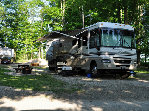 Large RV in a shady site