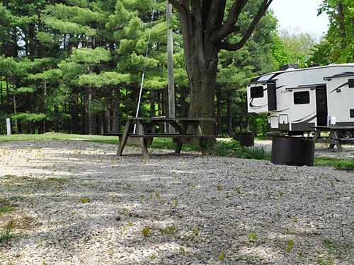 Gravel RV site with table and fire pit