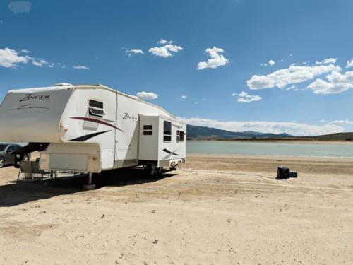 Parked trailer at site Sandy Beach at Yuba Lake