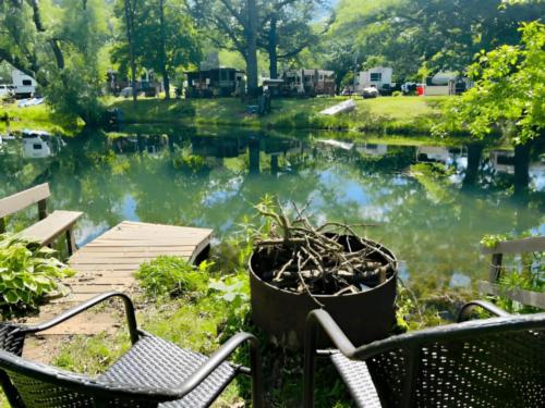 Fire pit with water view at Golden Acres Park