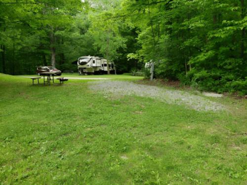 Parked trailer at site Stetson's Tumble Hill Campground
