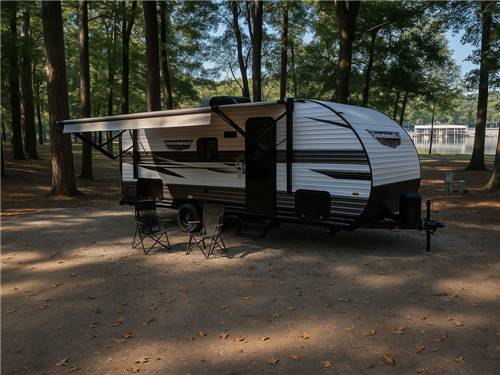 An RV in a shaded site