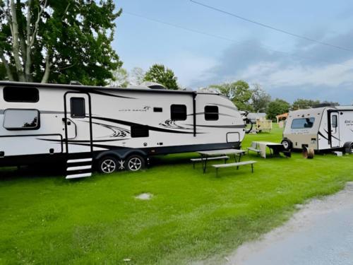 Parked trailers at site 10 Acres Campground