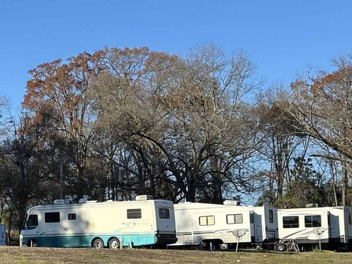 A row of RVs at The Barn RV Park