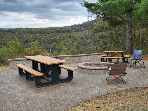 Table and firepit at site Wood Mountain Campground