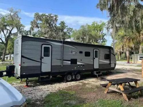 Parked trailer at site Shell Harbour RV Resort