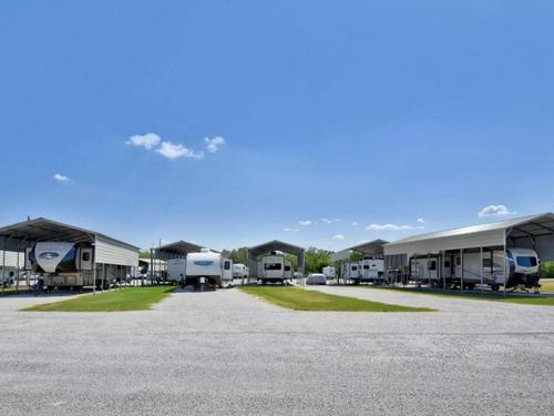 Parked covered trailers at site David's RV Park