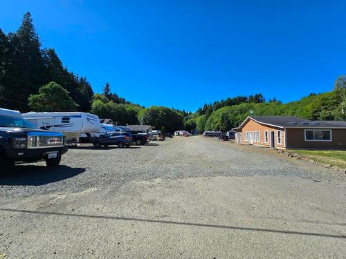 Parked trailers and vehicles at site Fisherman's Cove RV Park