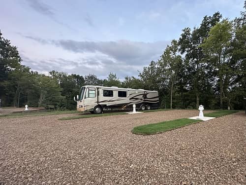Class A motorhome parked at site