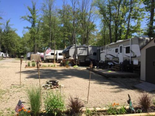 RV sits among trees at Country Acres Campground