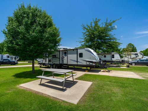 Parked trailer at site Antique Capital RV Park