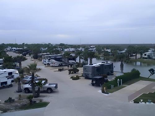 Parked RV's and trailer's at site Gulf Waters Beach Front RV Resort