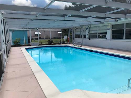 The screened-in pool awaits you at TICE COURTS & RV PARK