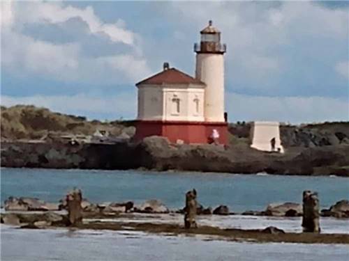 A lighthouse on the ocean at Bandon By the Sea RV Park