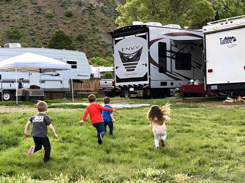 Kids playing by campsites at Big Rock Candy Mountain Resort