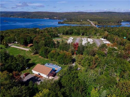 Aerial view of swimming pool and sites at ADVENTURES EAST CAMPGROUND & COTTAGES