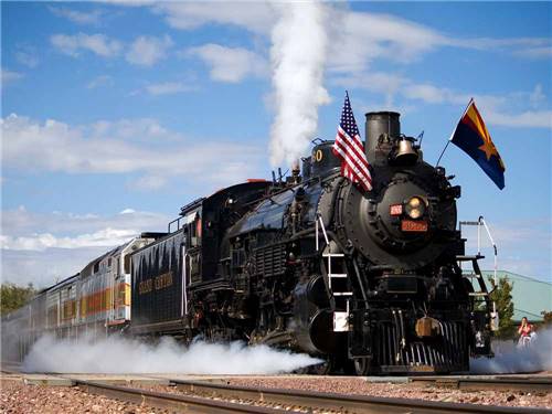 Train blowing smoke out at GRAND CANYON RAILWAY RV PARK