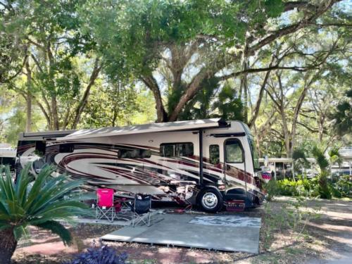 RV in tree lined site