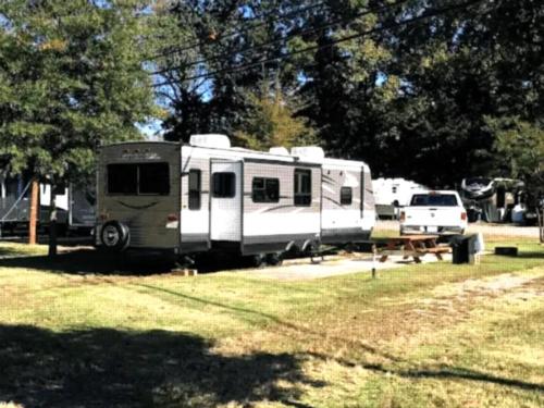 Parked RV with panic area at site Indian Heritage RV Park