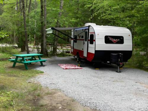 Trailer and green picnic table