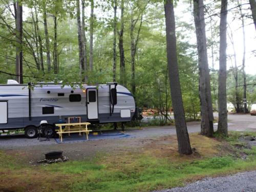 Trailer and yellow picnic table