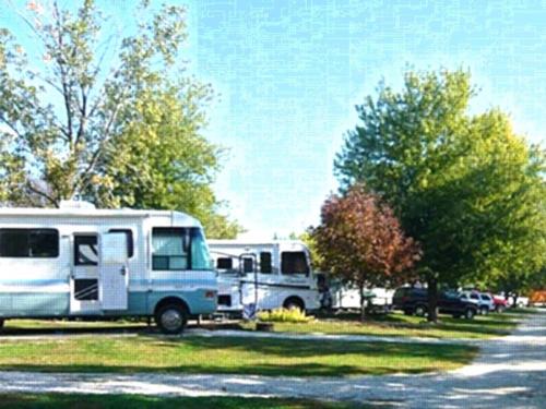 Parked RV's at site Yogi Bear's Jellystone Park at Pine Lakes