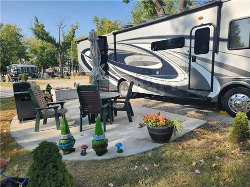A table with chairs and an umbrella at a site