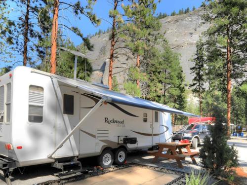 RV in a site with picnic table