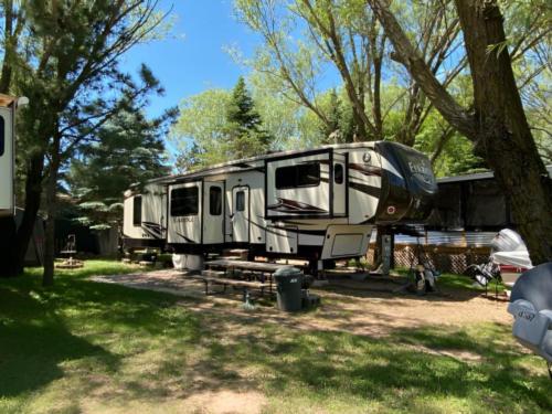 Parked trailer at site River Bay Camping Resort & Marina
