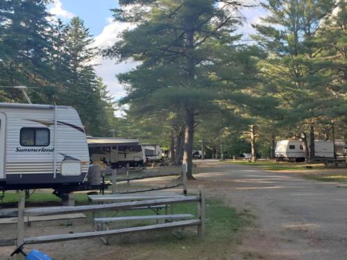 Parked trailers at site Spacious Skies Adirondack Peaks