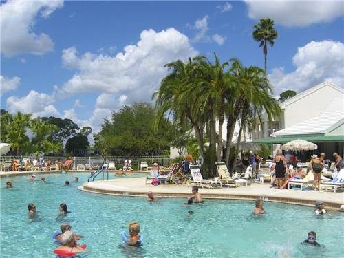 People swimming in the pool at ENCORE FORT MYERS BEACH