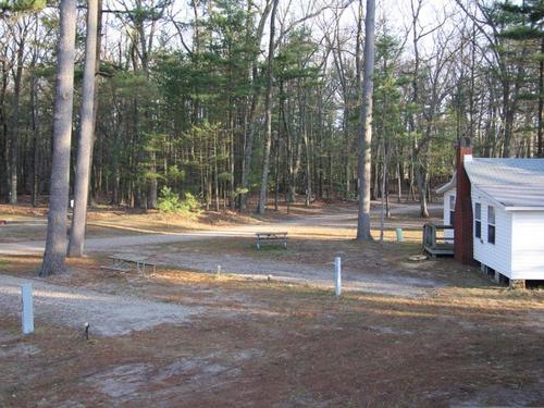 Gravel RV pads at Whispering Surf Campground At Bass Lake