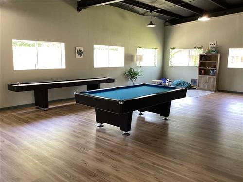 A pool table and shuffleboard table at Vinton RV Park