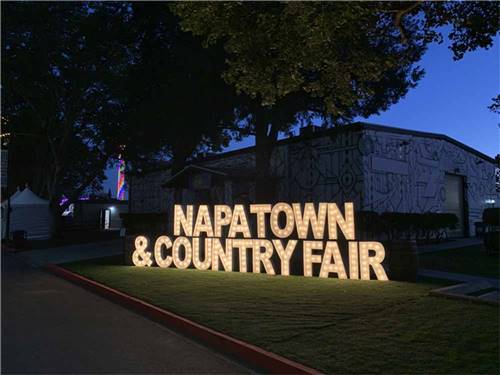 The lit up front entrance sign at NAPA VALLEY EXPO RV PARK