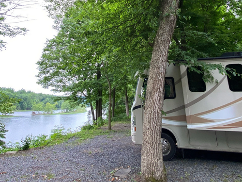 RV with a river view at Kittatinny River Beach Campground