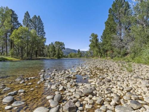 Rocky shore by river at Junction West Durango Riverside Resort