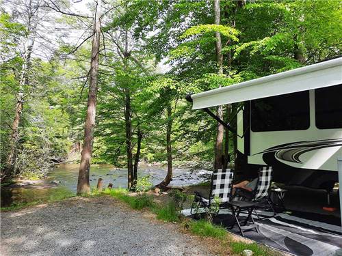 An RV site along the water at GREENBRIER CAMPGROUND