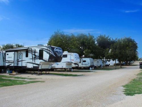 RVs parked in a row at WHIP IN RV PARK
