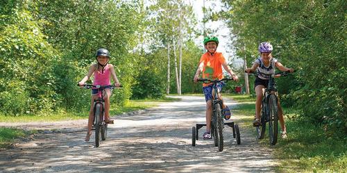 Kids riding bikes at campground