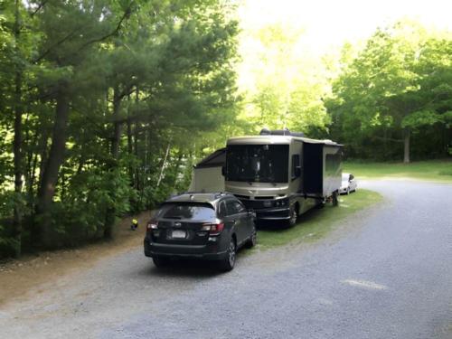 Parked RV at site Pine Hollow Campground