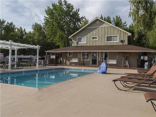 The swimming pool with lounge chairs at Lakeside RV Campground