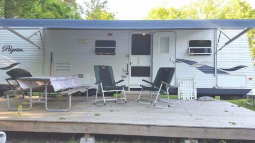RV parked with patio at East Lake Camping