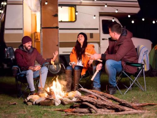 People sitting by a campfire