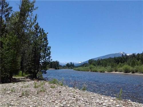 View of the river with distant mountains at BLACK RABBIT RV PARK