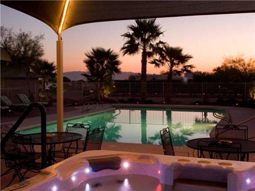 The hot tub and swimming pool at night at BLACK ROCK RV VILLAGE